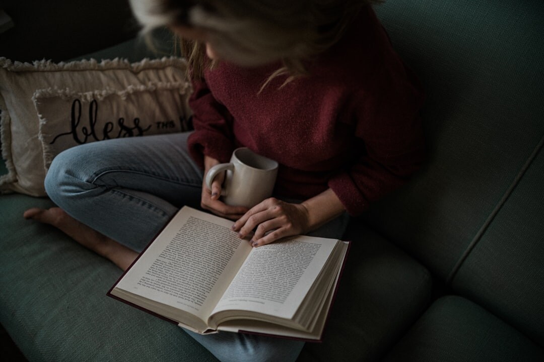 person reading thriller book